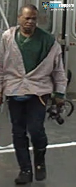 man wearing beige jacket and dark pants