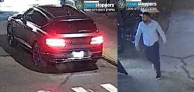 a dark-colored car and a man wearing light shirt and dark pants