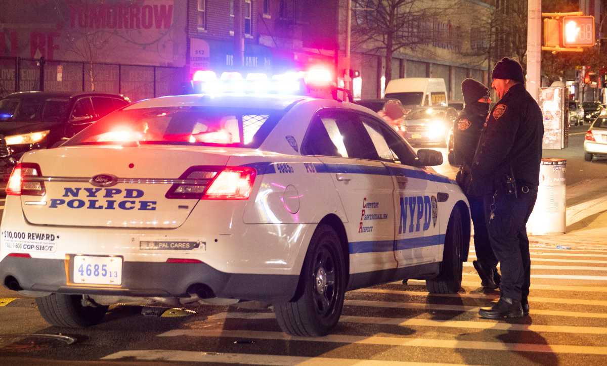 Two men shot near Brooklyn public housing complex 2 police car at scene where men were shot in brooklyn