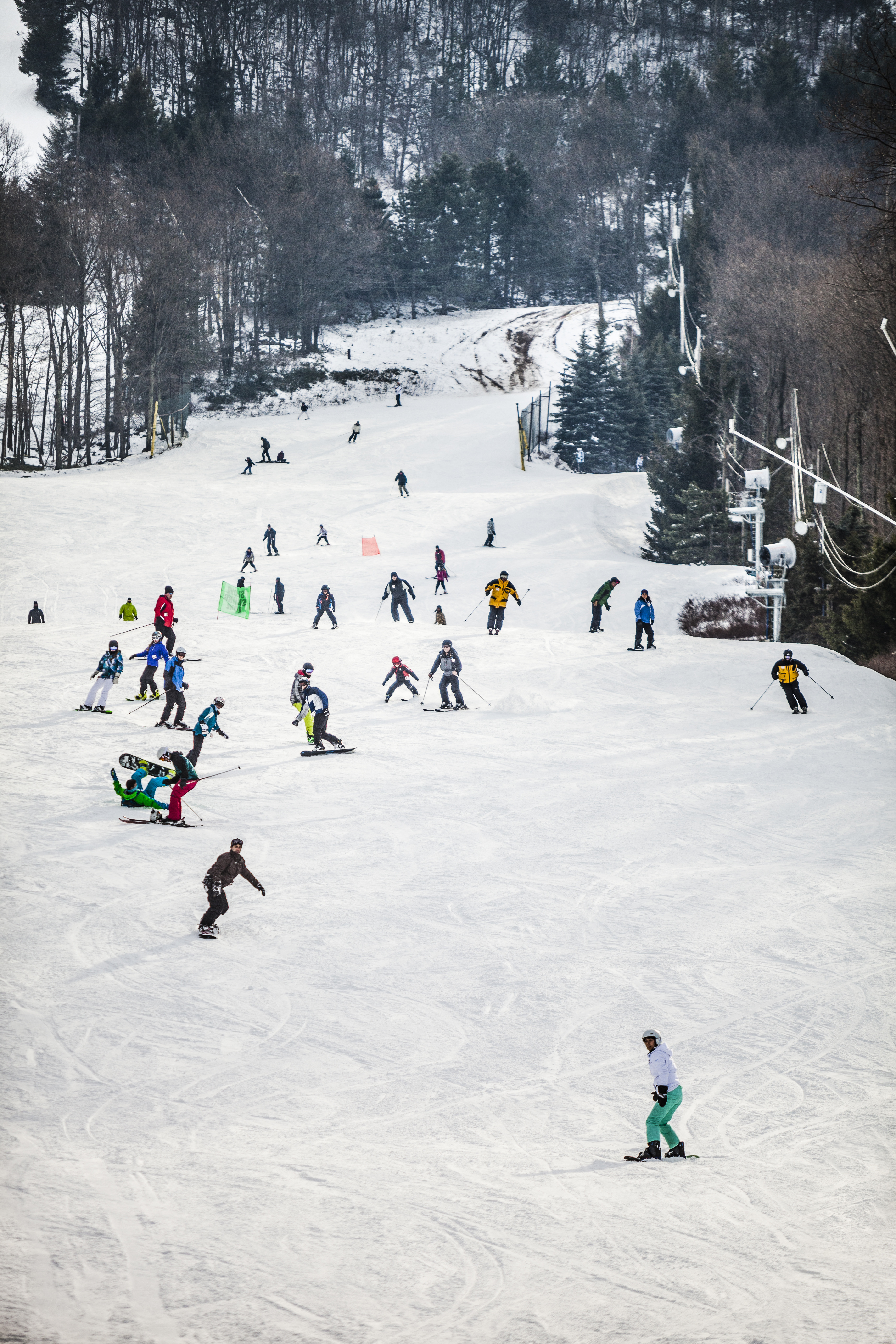 Things to do this winter in the Poconos 2 Tannersville, USA - February, 1, 2014: Crowd skiing at the slope in the Camel Back resort in Poconos, Pennsylvania.
