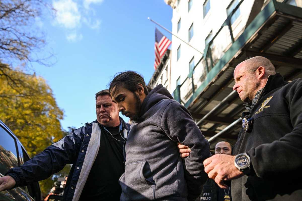 Suspect in Midtown subway arson case escorted by detectives in handcuffs