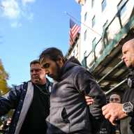 Midtown subway arson: Suspect who allegedly set sleeping man on fire apprehended, faces federal prosecution 3 Suspect in Midtown subway arson case escorted by detectives in handcuffs