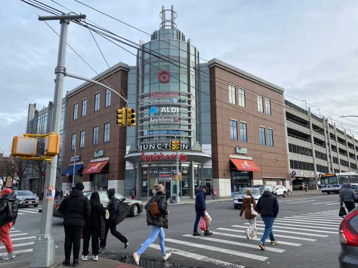 people crossing a busy intersection in Brooklyn