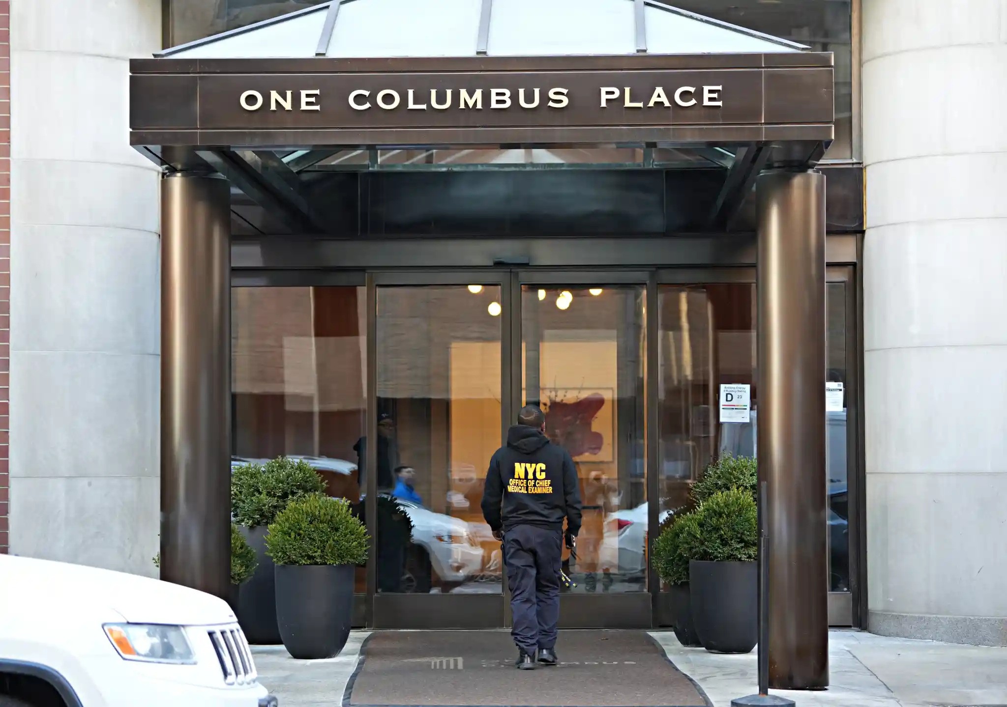 Medical examiner enters Michelle Tractenberg's apartment building. this was the most-read web story on amNY this year.