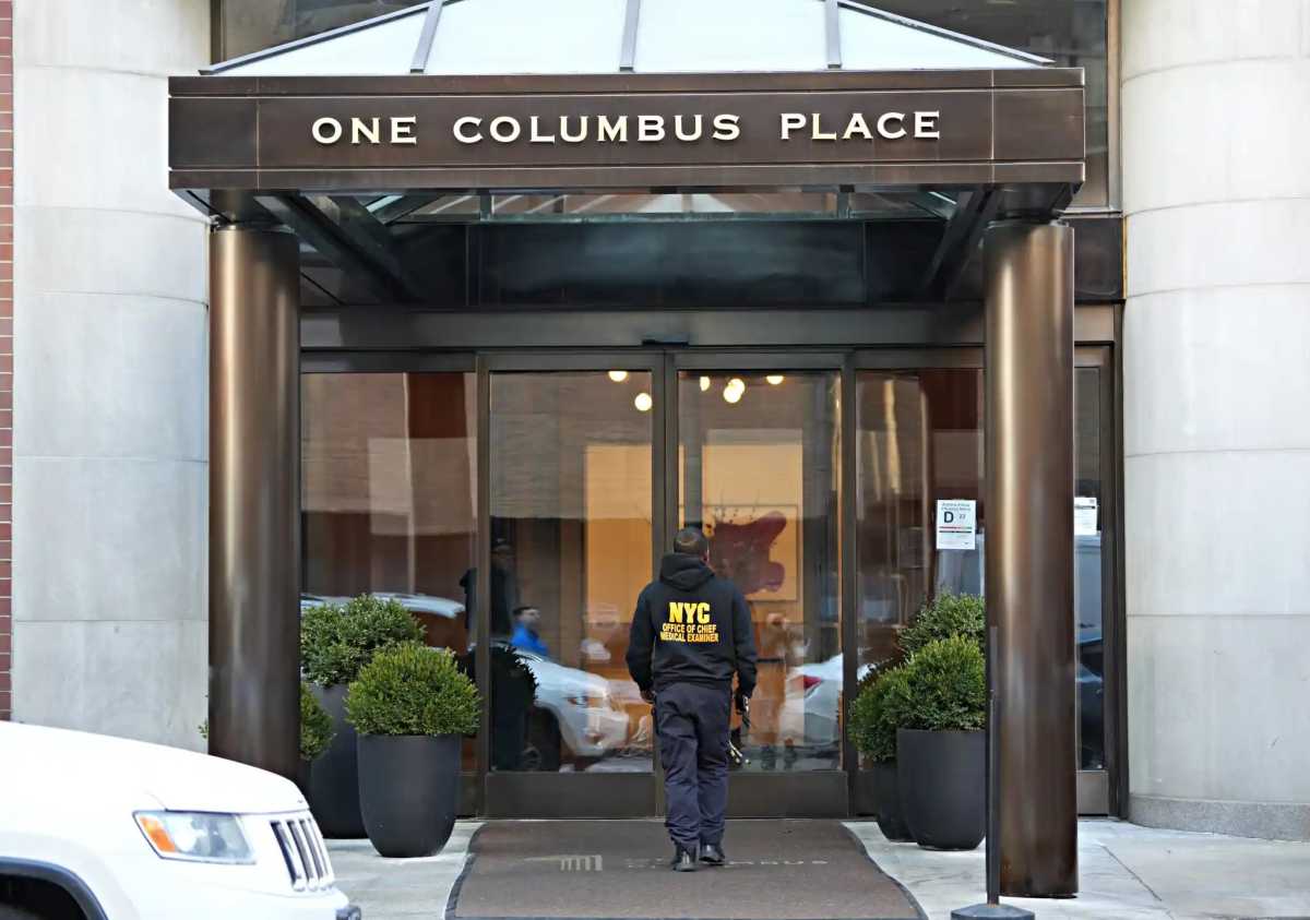 Medical examiner enters Michelle Tractenberg's apartment building. this was the most-read web story on amNY this year.