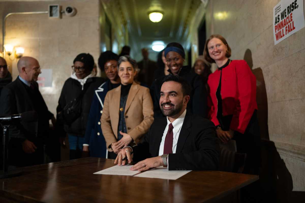 Mayor Zohran Mamdani pictured signing three of his first five executive orders aimed at tackling the city’s housing crisis during a press conference at an apartment building in Brooklyn