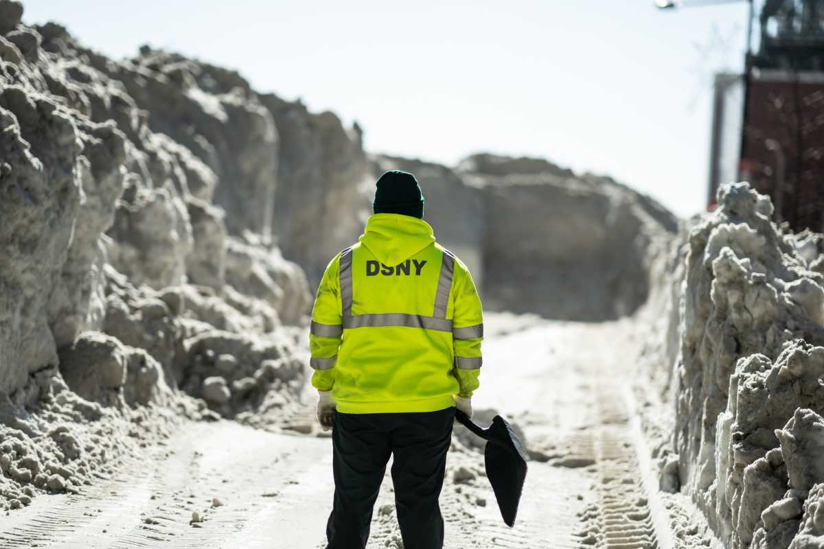 Still digging out: Mamdani says city has cleared mounds of snow from 100% of bus stops with shelters, days after winter storm 2 city worker in front of massive pile of snow following winter storm