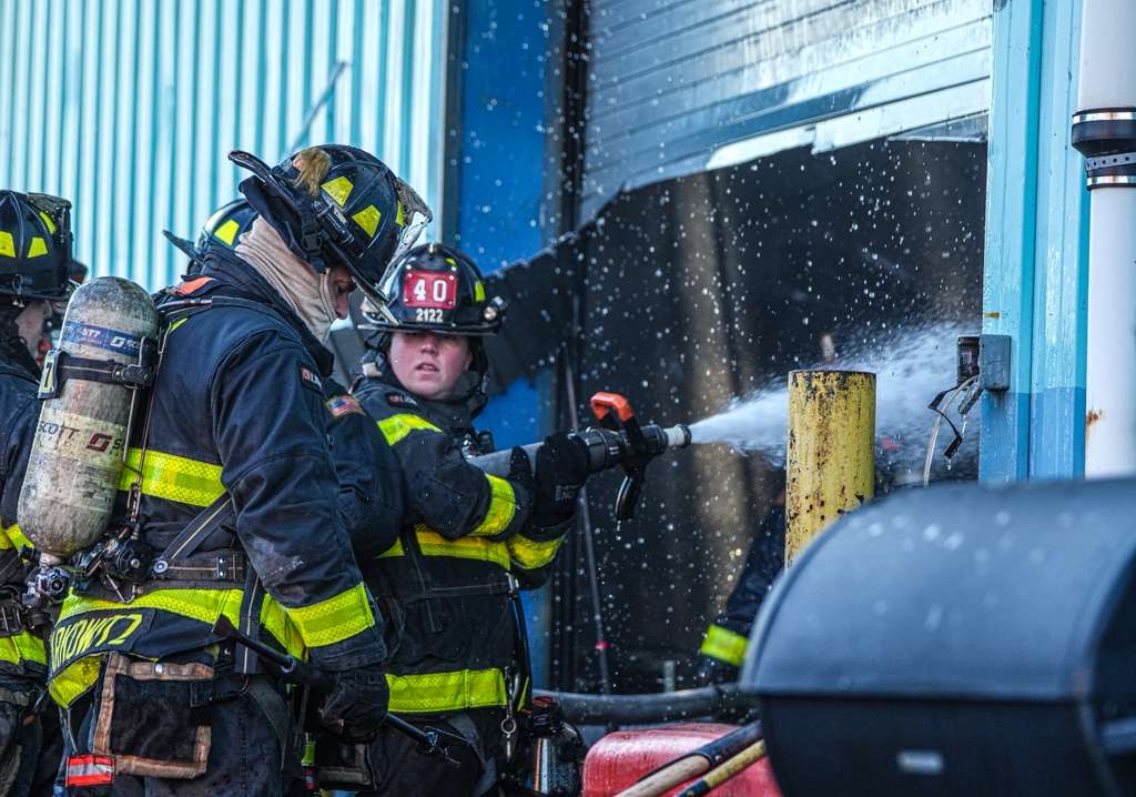 firefighters in brooklyn fight a four-alarm fire at a warehouse