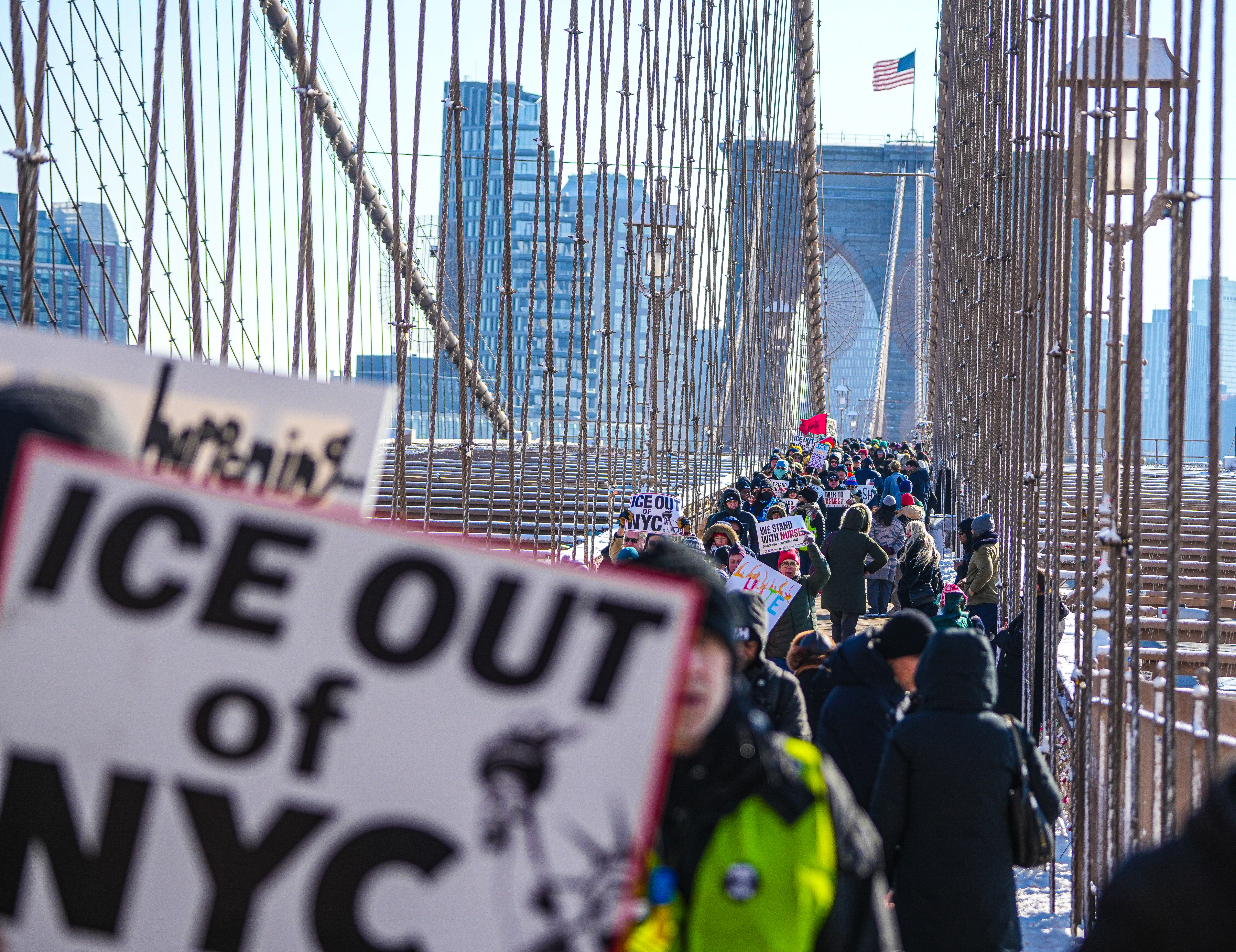 People marching on MLK Day across the Brooklyn Bridge against ICE