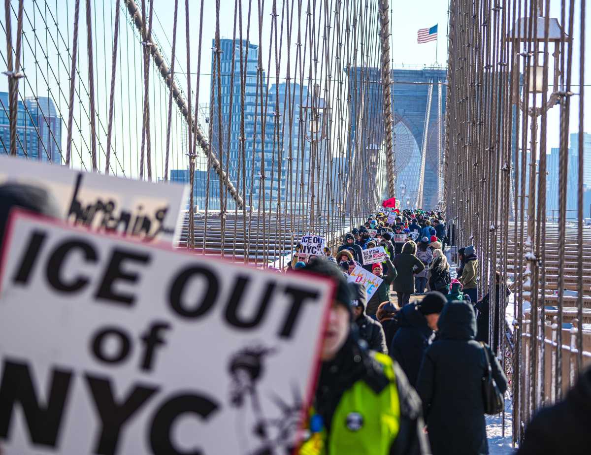 People marching on MLK Day across the Brooklyn Bridge against ICE