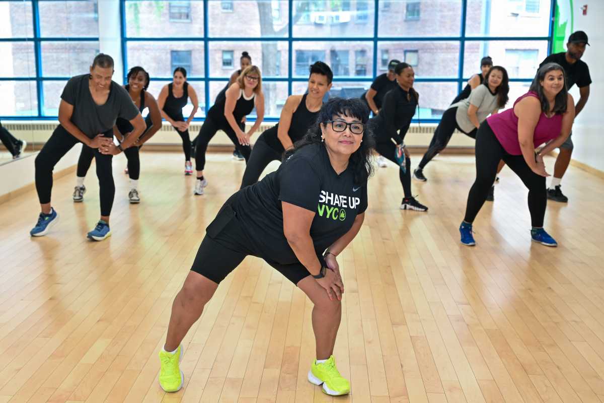 a group of people in an exercise studio participating in one of many free fitness classes in NYC
