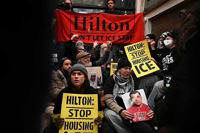 No vacancy: 65 anti-ICE protesters arrested after lobby protest inside Lower Manhattan Hilton hotel, NYPD says 3 Anti-ICE demonstrators hold signs while occupying Hilton hotel
