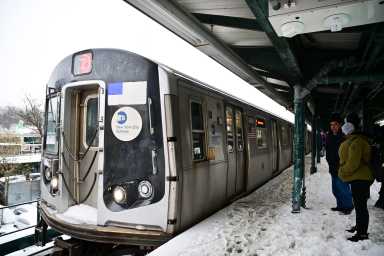 subway train running after winter storm