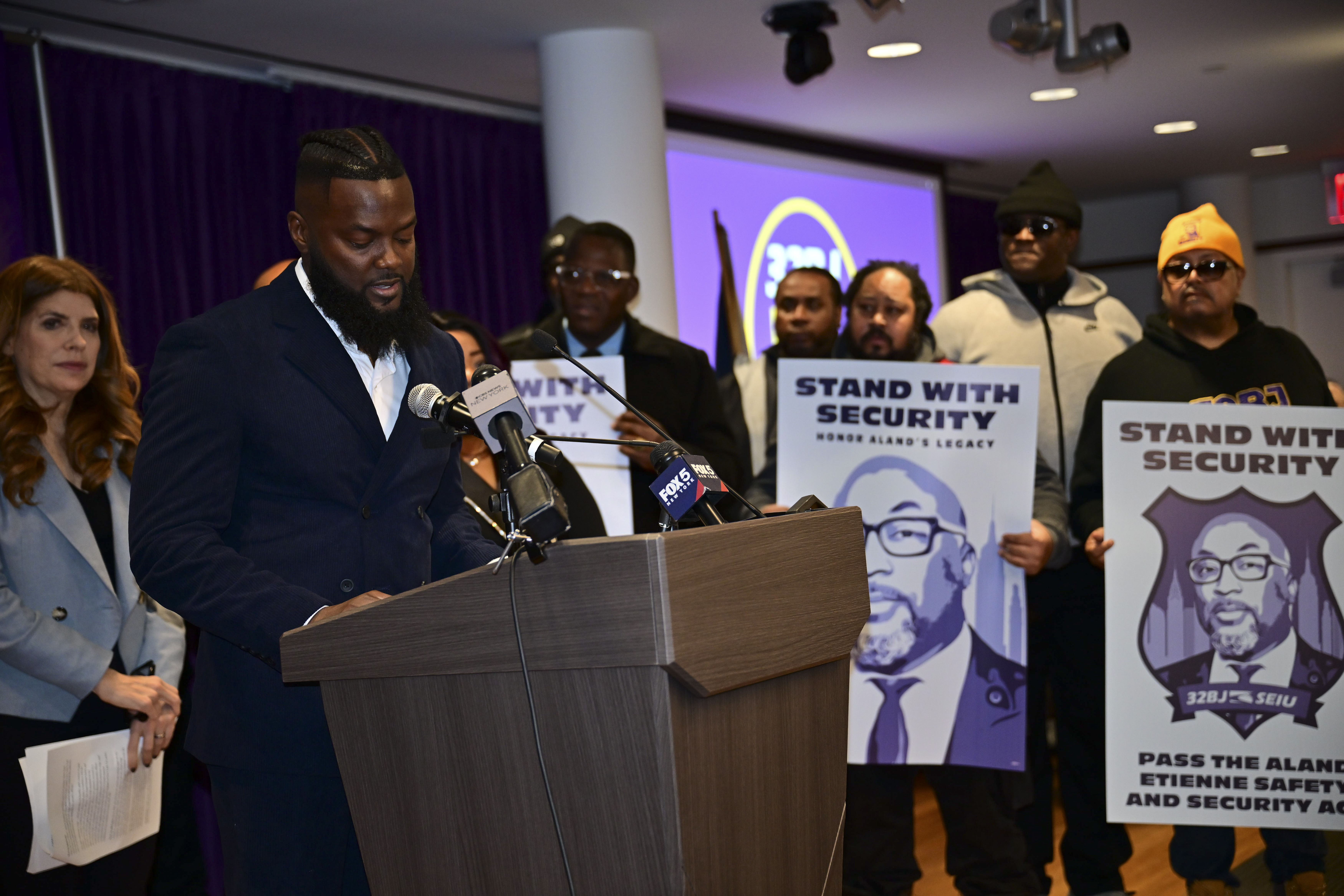 Rally attendee speaks on bill to improve wages for security guards