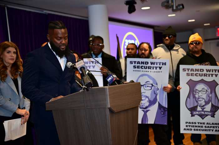 Rally attendee speaks on bill to improve wages for security guards