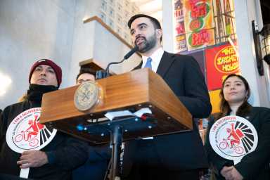 Mayor Zohran Mamdani speaking at microphone