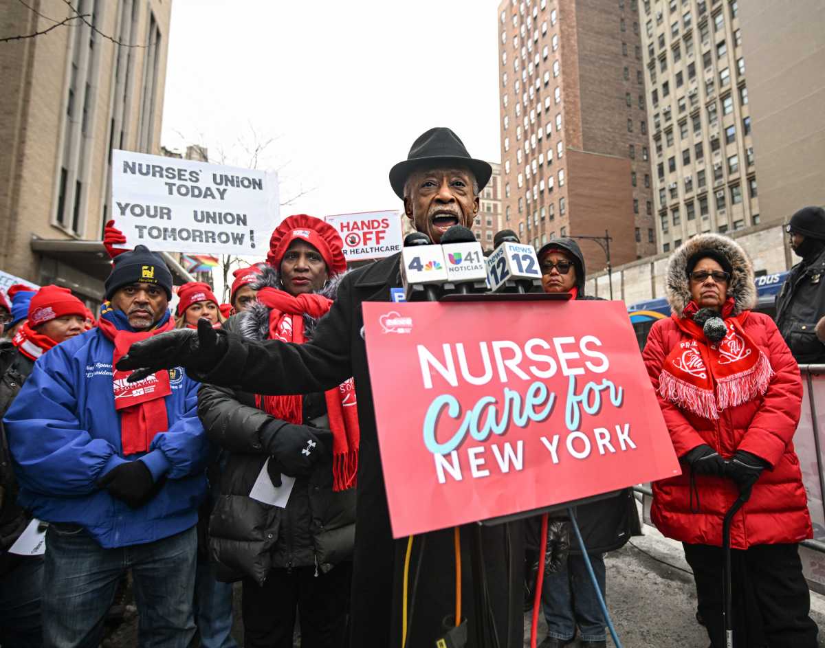 Rev. Al Sharpton stands with striking nurses in Upper Manhattan on MLK Day, Jan. 19.