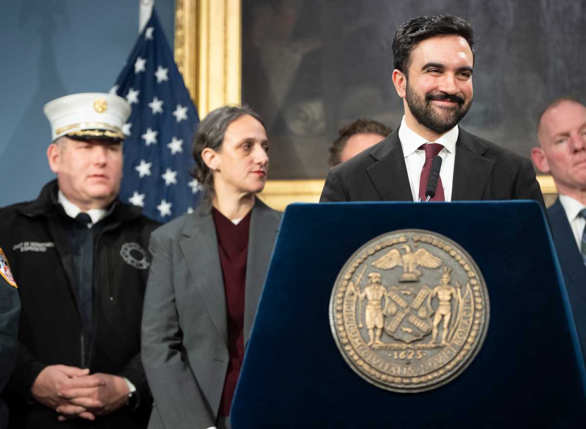 Mayor Zohran Mamdani smiles during press briefing