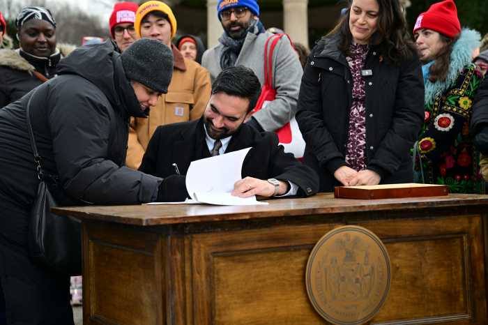 Mayor Zohran Mamdani signing an executive order in Brooklyn on Jan. 2, 2025.