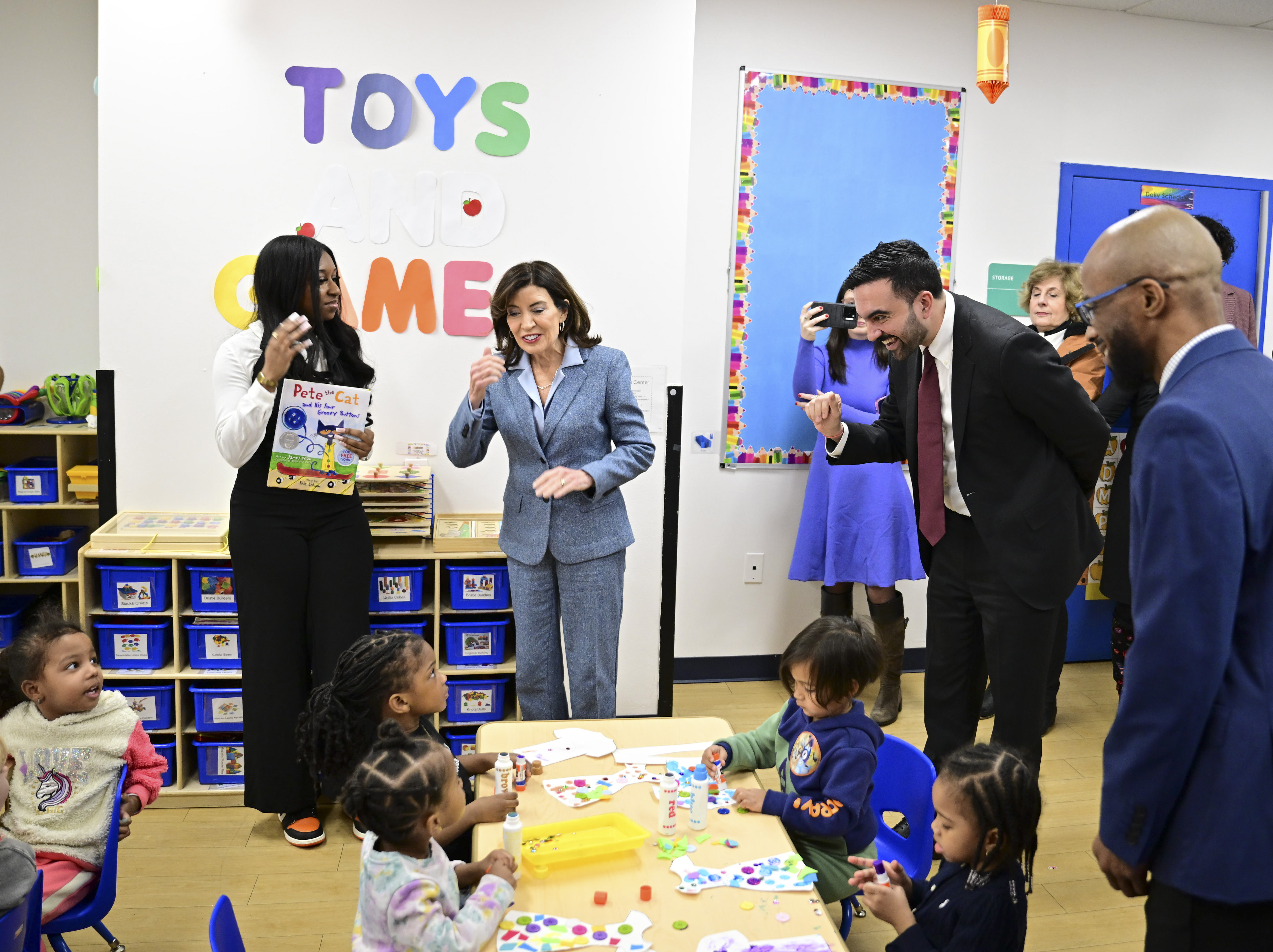 Gov Hochul (left ) and Mayor Zohran Mamdani (Right) greet pre-schoolers at a YMCA in Flatbush, Brooklyn on Thursday, January 8.