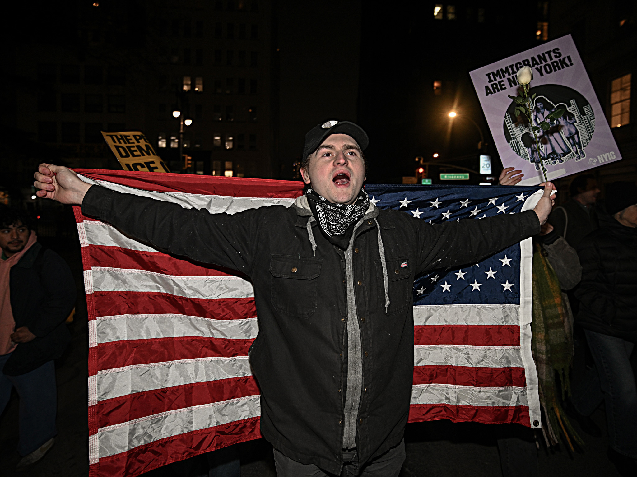 Man with American flag protesting in Foley Square after ICE shooting in Minneapolis