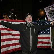 New Yorkers rally in Foley Square after ICE agent shoots woman dead in Minneapolis 8 Man with American flag protesting in Foley Square after ICE shooting in Minneapolis