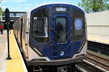 A train with subway conductor in Queens