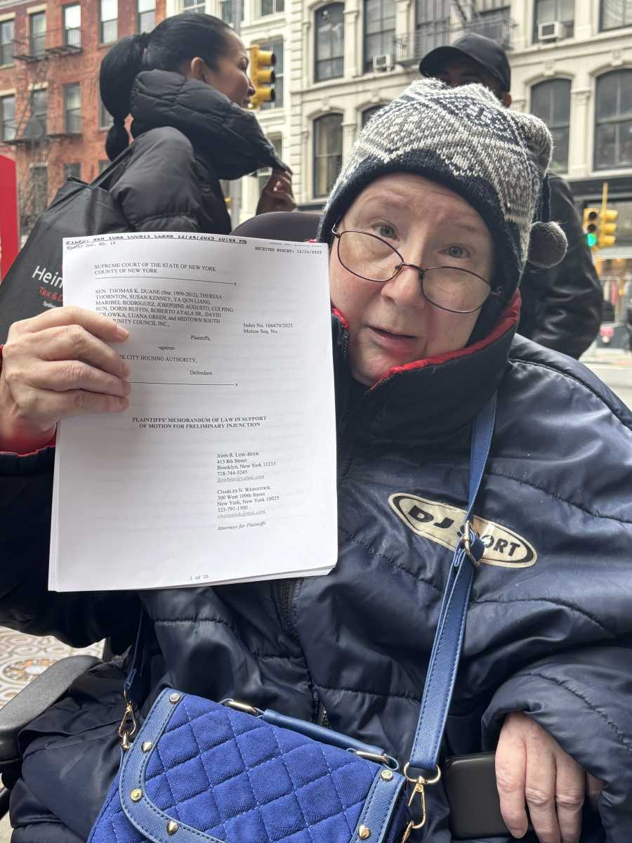 Plaintiff Theresa Thornton holds the motion for a temporary injunction