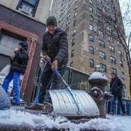 WINTER STORM WARNING: NYC expected to get at least 10 inches of snow. Here's what you need to know. 6 man shoveling snow during winter storm
