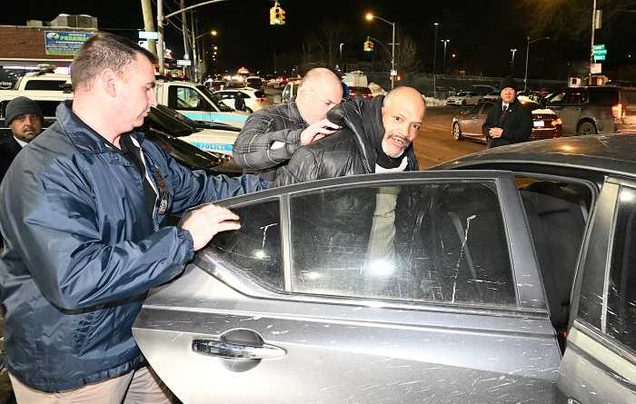 suspect in deadly bronx fire led into police car