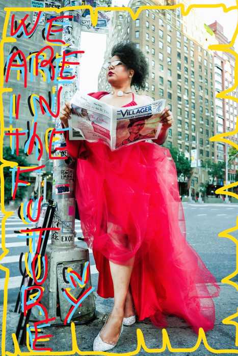 woman in a red dress reading a newspaper