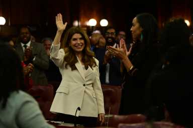 Speaker Julie Menin waves