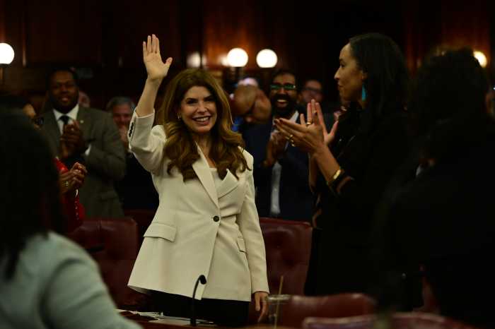 Speaker Julie Menin waves