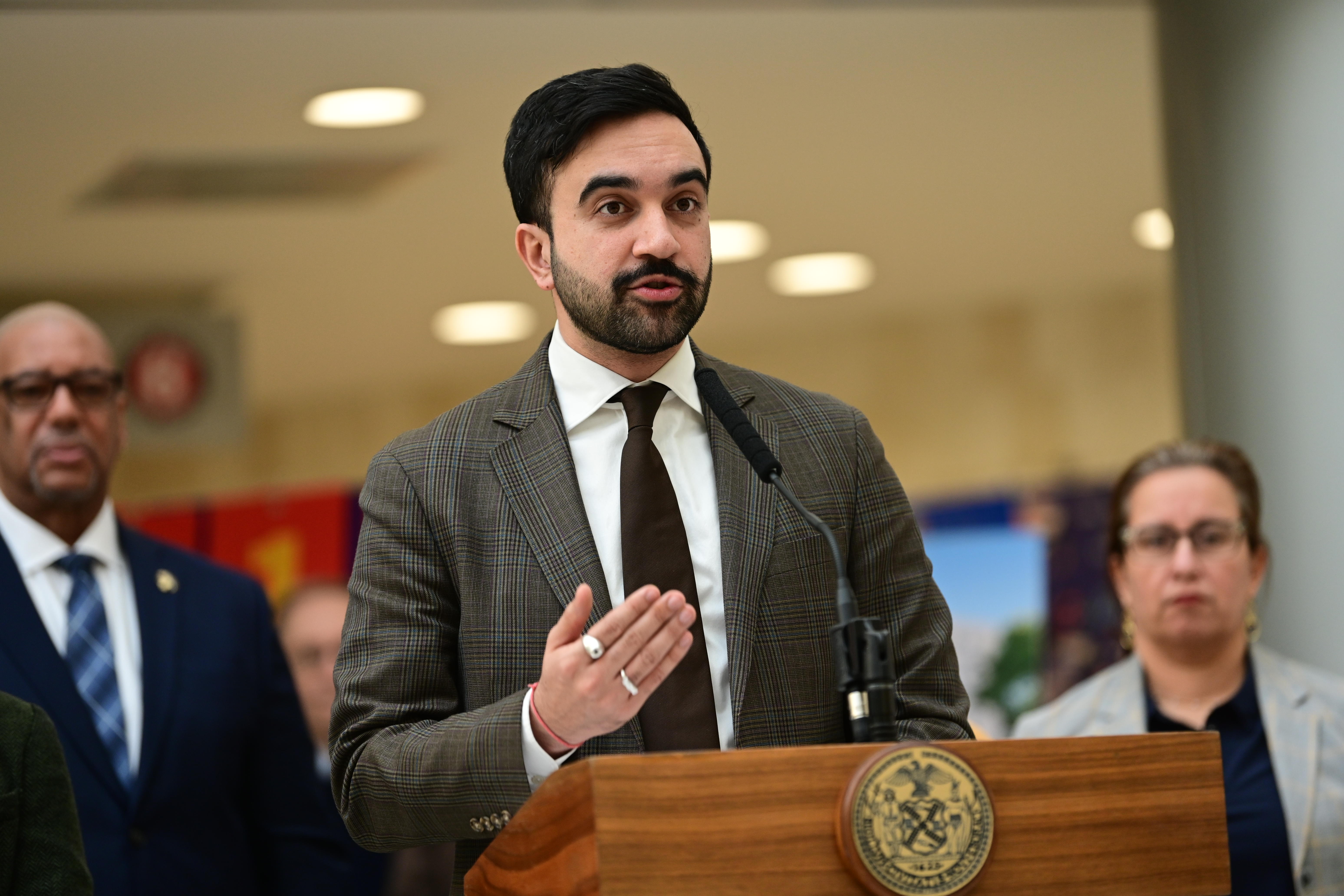 Mayor Zohran Mamdani speaking at a podium