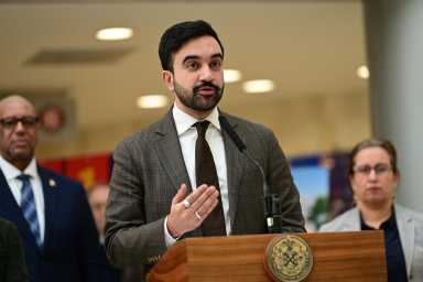 Mayor Zohran Mamdani speaking at a podium