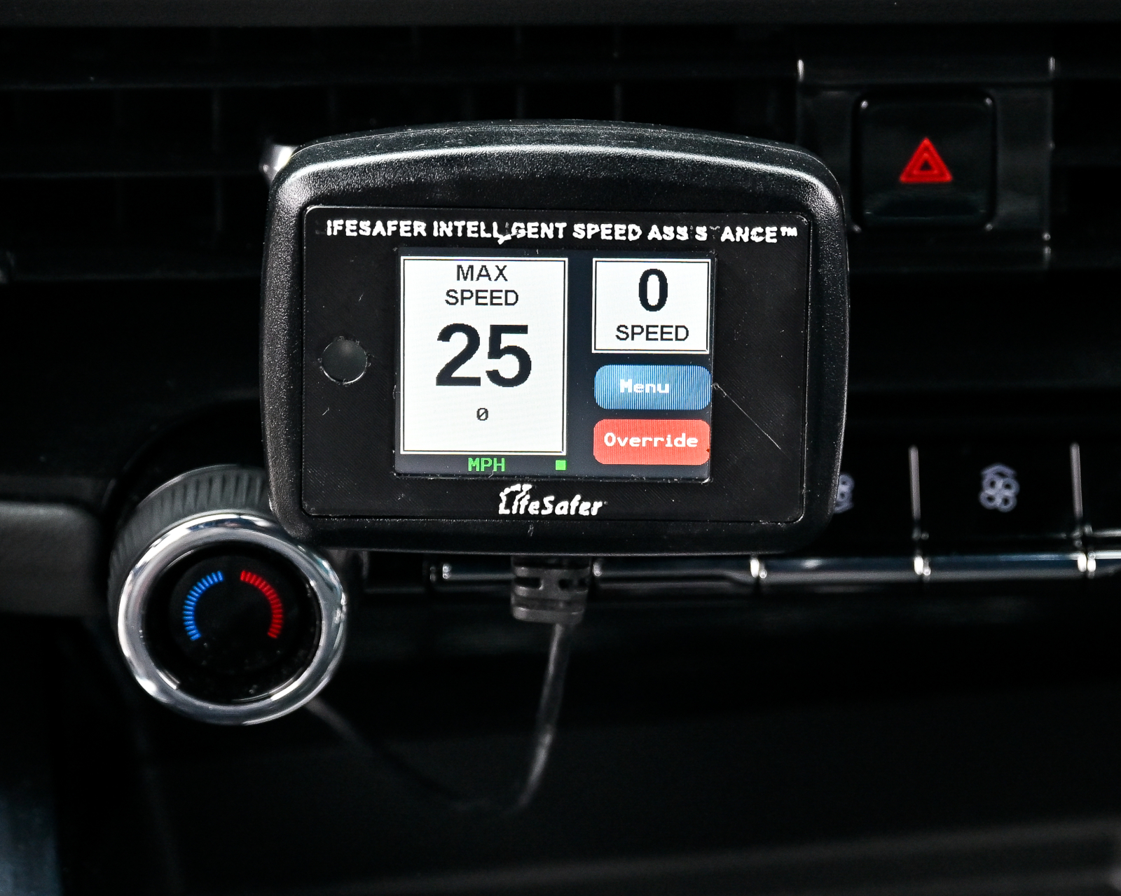 Speed limiting devices on the dashboard of a car