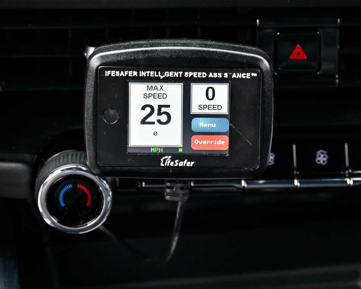 Speed limiting devices on the dashboard of a car