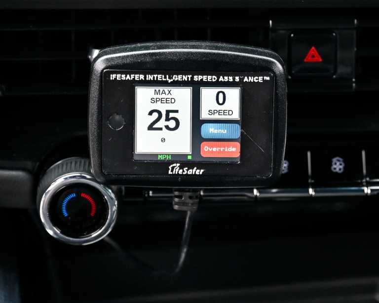 Speed limiting devices on the dashboard of a car