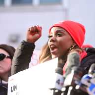 NURSES STRIKE: Contract talks continue between caretakers and hospitals; progress made at NewYork-Presbyterian 6 woman wearing red holding a sign