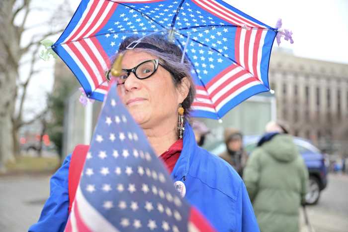 woman holding a patriotic umbrella