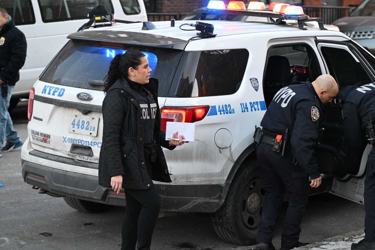 Police at scene of Queens homicide where man was shot dead.