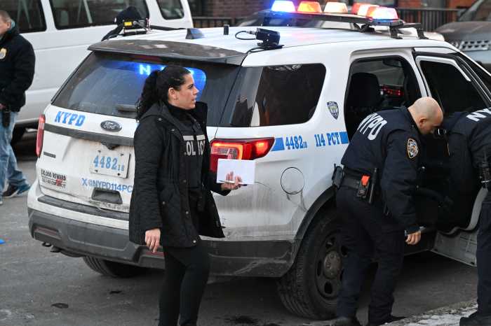 Police at scene of Queens homicide where man was shot dead.