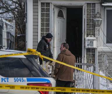 detectives at front door of Queens home after police-involved shooting