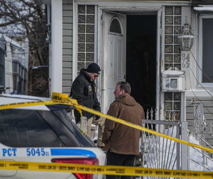 detectives at front door of Queens home after police-involved shooting