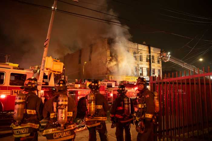 Firefighters at scene of Queens three-alarm fire