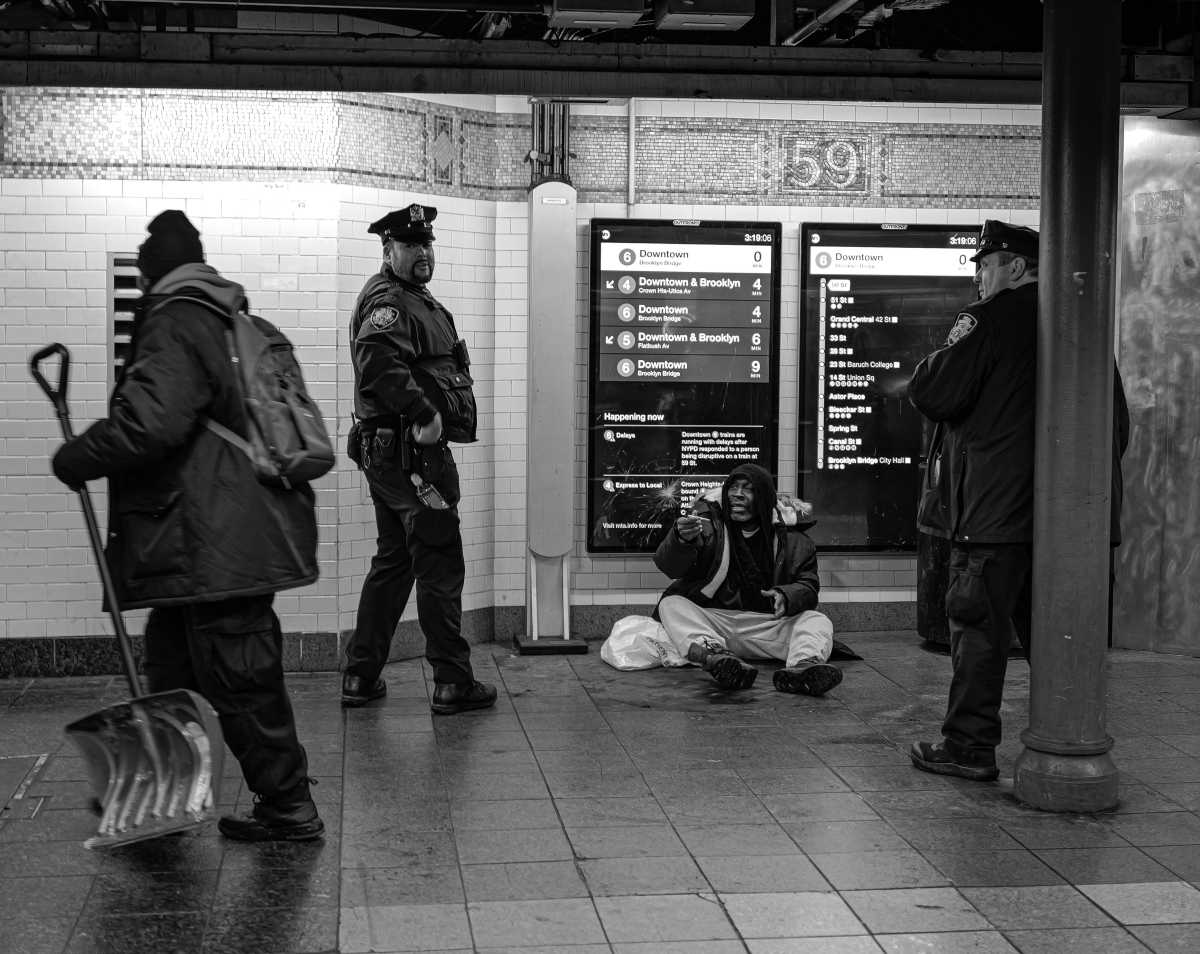 Homeless man in subway train
