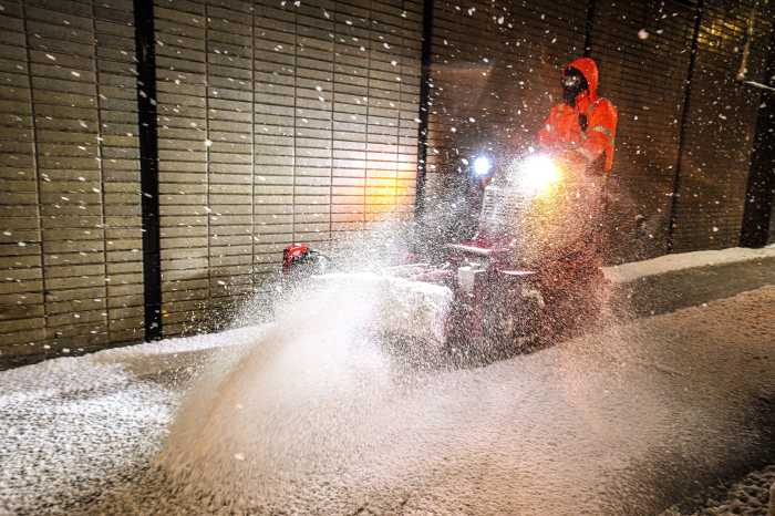 Man plows sidewalk during NYC Blizzard
