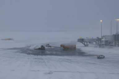 snow from NYC blizzard at LaGuardia Airport