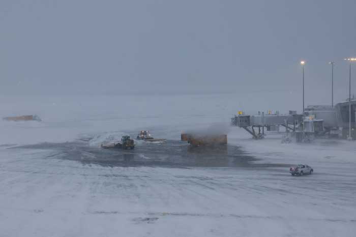 snow from NYC blizzard at LaGuardia Airport