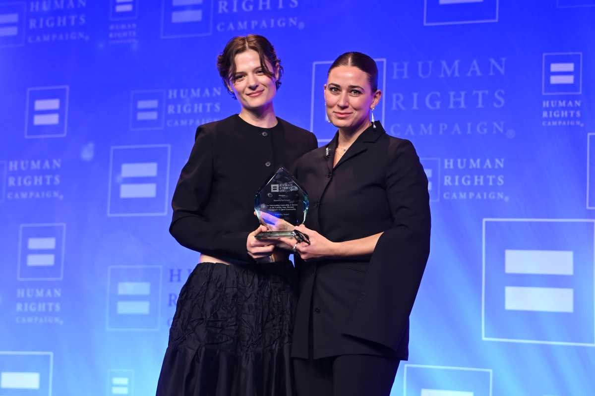 (L-R) Louisa Jacobson presents the Visibility Award to Daniella Kallmeyer onstage during the Human Rights Campaign 2026 Greater New York Dinner at Marriott Marquis Times Square on February 07, 2026 in New York City.  (Photo by Bryan Bedder/Getty Images for Human Rights Campaign)